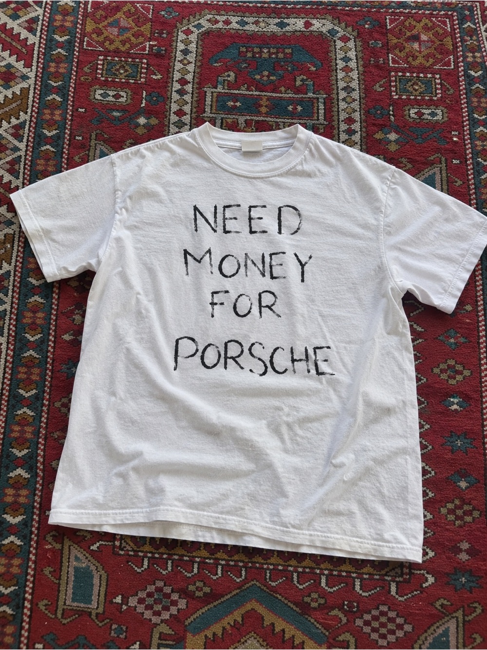 White Short-Sleeve Graphic Tee with Handwritten 'Need Money For Porsche'